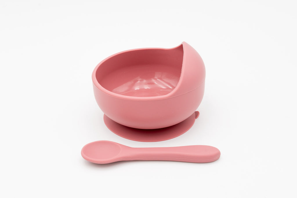 Taça rosa-escura com ventosa e colher a condizer
